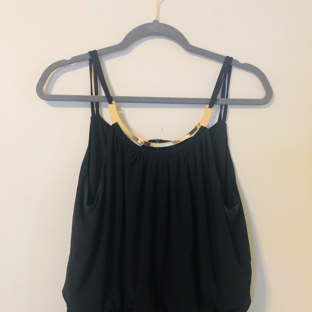 Black jumpsuit with gold plated neck